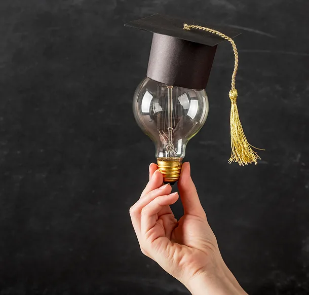 A graduation cap and light-bulb illustration